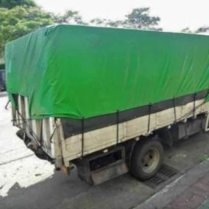 Truck covered with canvas